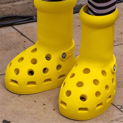 big yellow boots with holes.